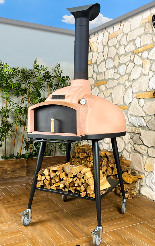 WPPO Red Rock 100 wood-fired oven on a patio with firewood stacked on the stand's lower shelf
